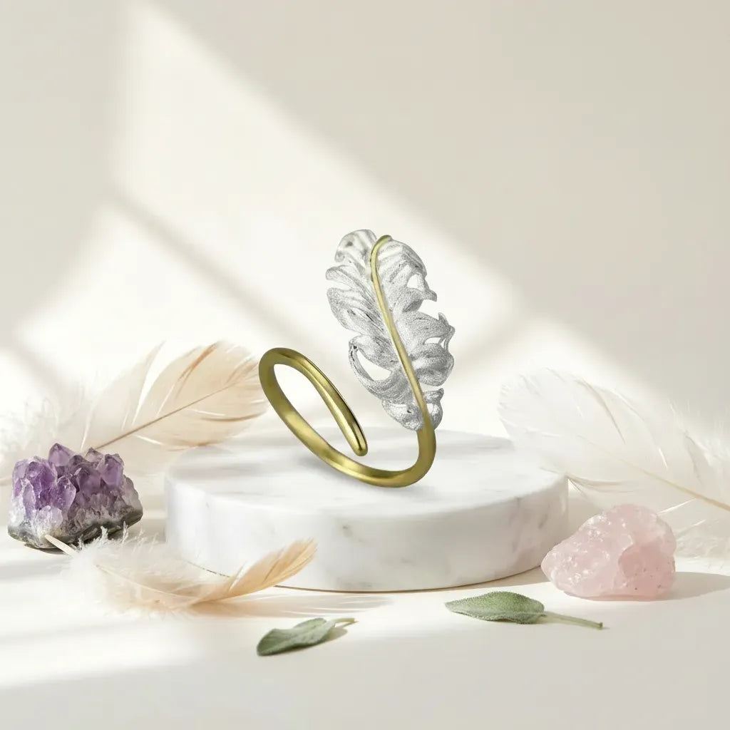 Decorative ring stand with crystals and feathers on a light background