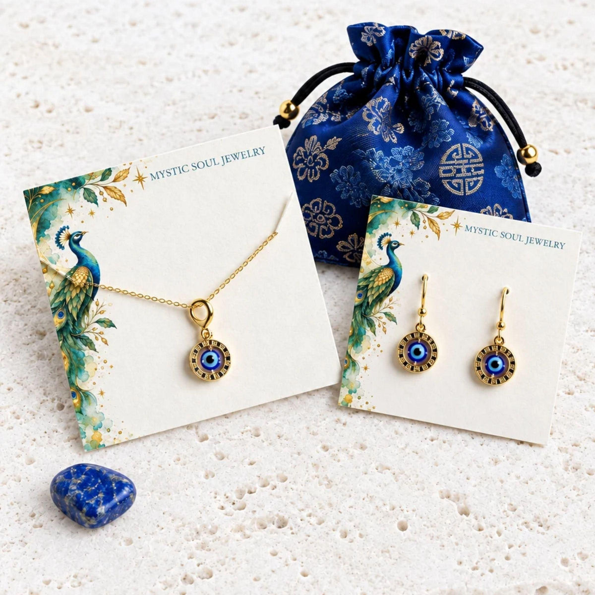Floating evil eye necklace and leverback earrings set in gold, with peacock gift card and blue gift pouch