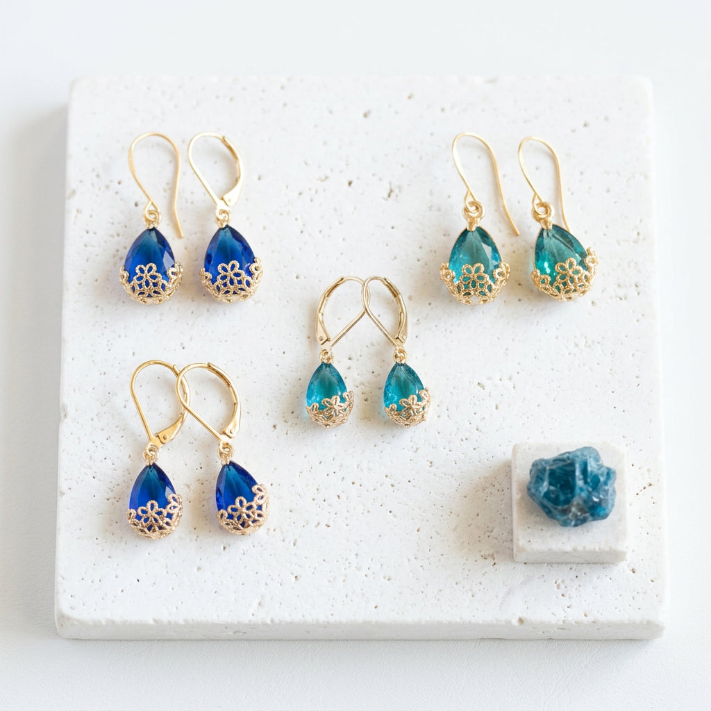 Aqua and Capri Flower-Cap earrings side by side in large and small sizes