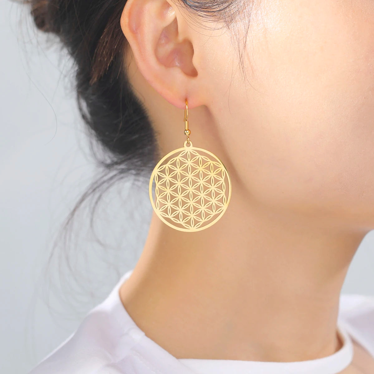Flower of life sacred geometry earrings in stainless steel — gold and silver options