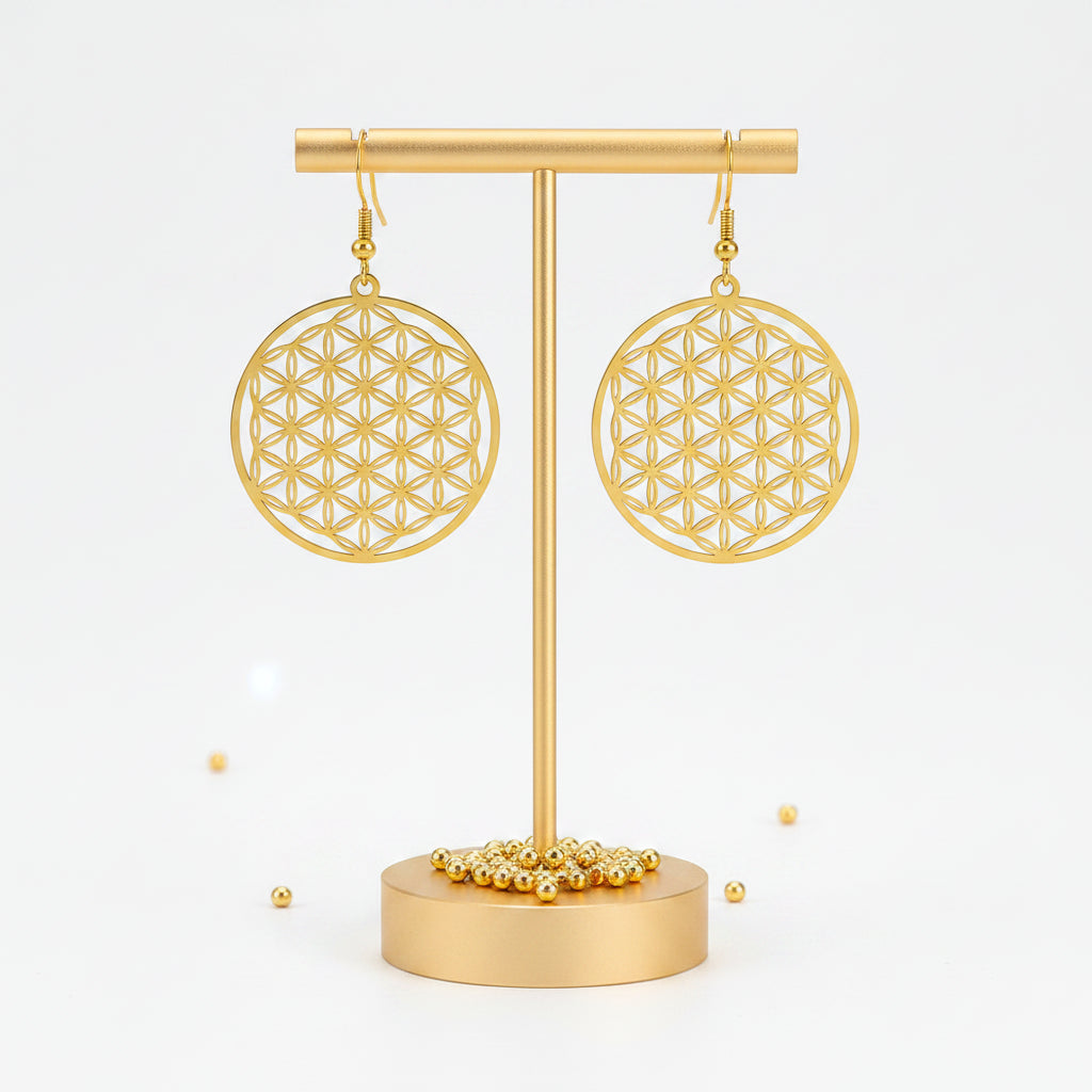Gold flower of life drop earrings on shepherd's hook earwires — sacred geometry jewelry