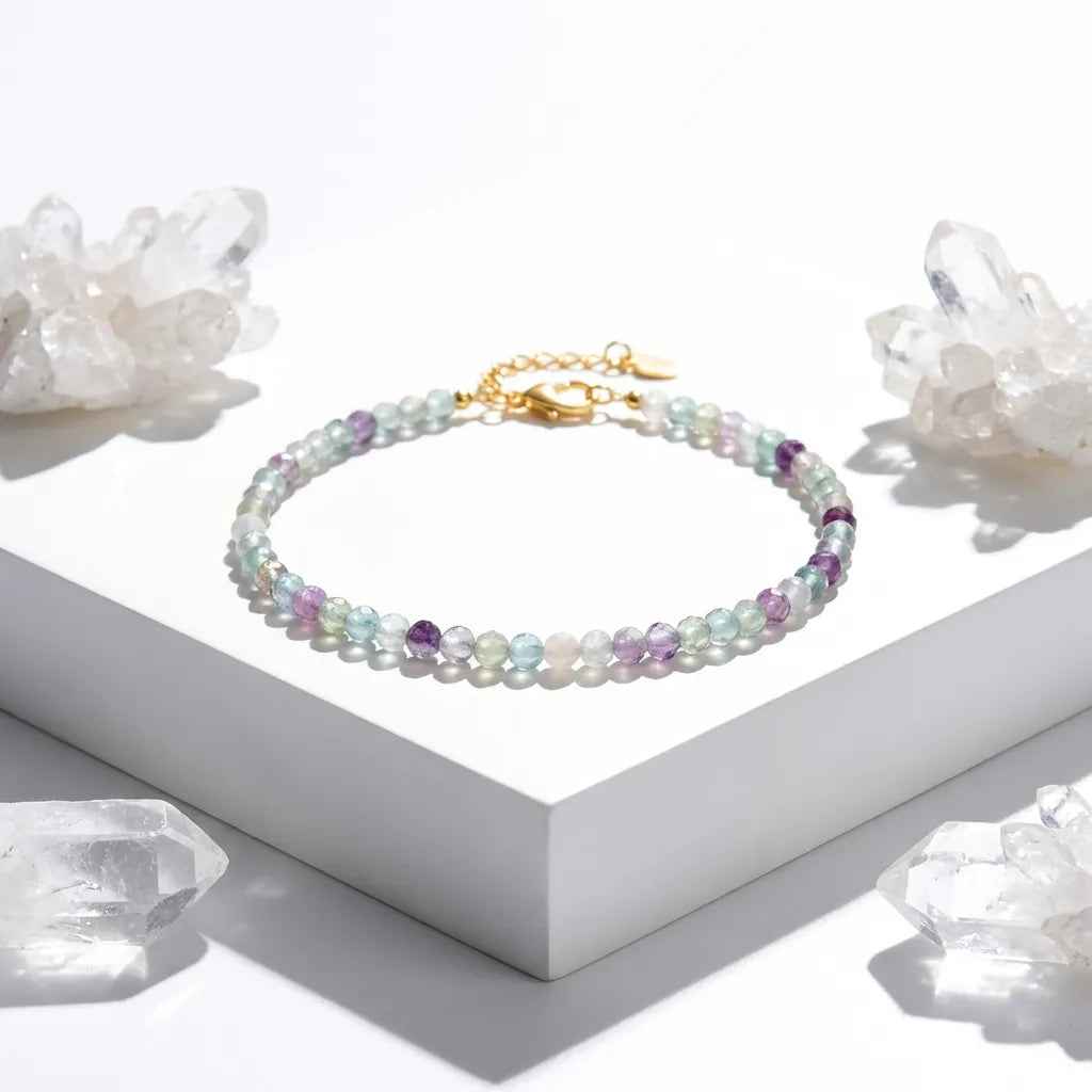 Multicolored beaded bracelet on a white surface with crystal formations