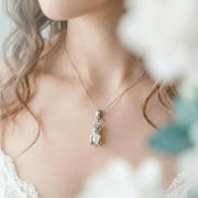 Woman wearing a silver French bulldog pendant necklace — keepsake necklace for love and rescue