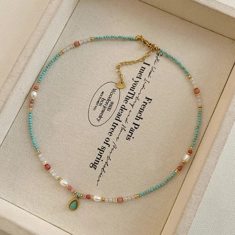 Handmade freshwater pearl and mixed gemstone beaded necklace with gold-set turquoise teardrop pendant  