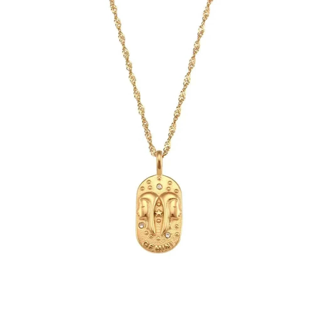 Gold necklace with a pendant on a white background