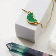 Green gemstone bracelet with a crescent moon charm, celestial jewelry