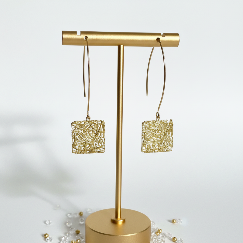 Gold plated square Global Connection long drop earrings on a white background