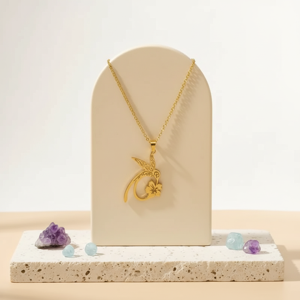 Gold hummingbird and flower pendant necklace in stainless steel — spirit animal jewelry