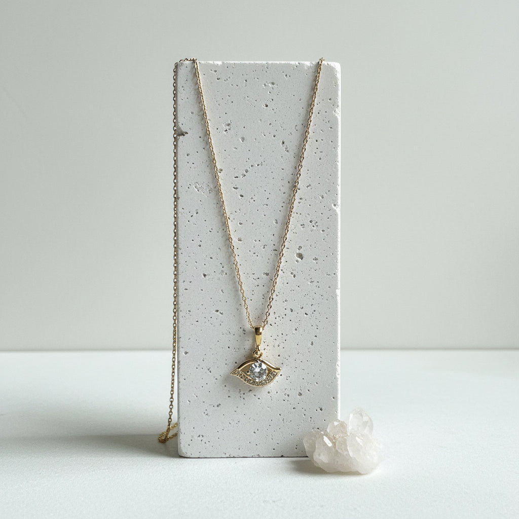 Gold plated crystal evil eye pendant necklace with a deep blue centre
