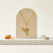 Gold hummingbird in flight pendant necklace on a long chain — spirit animal jewelry