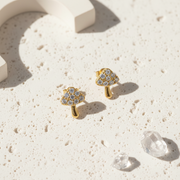 Tiny gold plated mushroom stud earrings with iridescent crystal toadstool caps