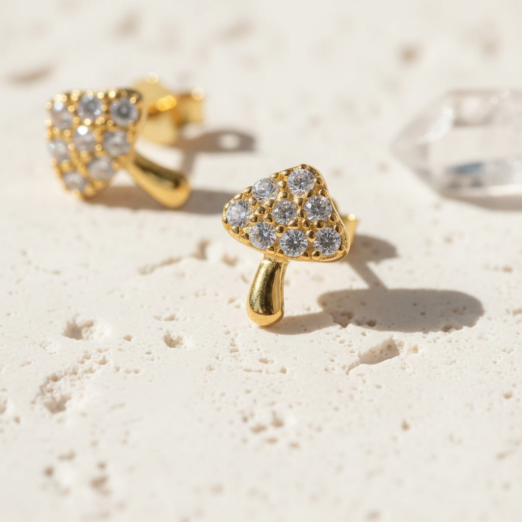 Close-up of crystal-set toadstool cap on a mushroom stud earring with sterling silver post