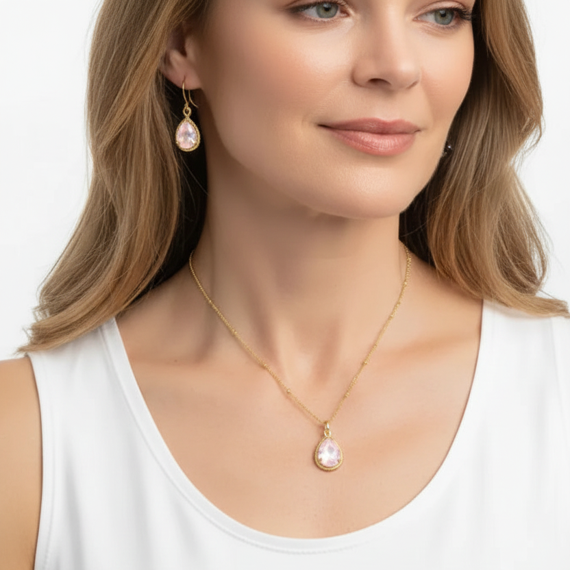 Woman wearing opalite exquisite necklace and earrings in gold, October birthstone jewelry