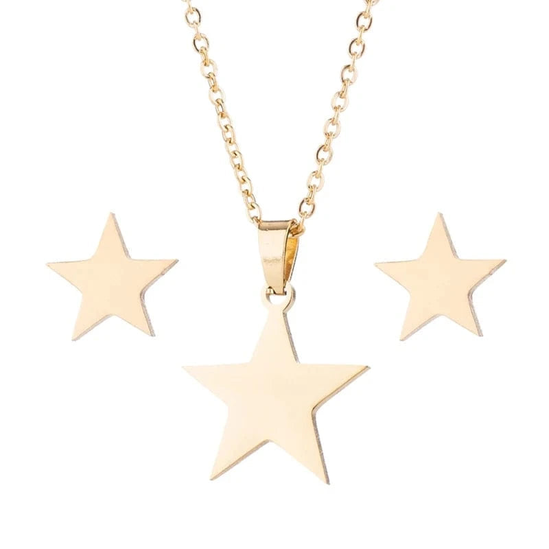 Gold star necklace and earrings on a white background