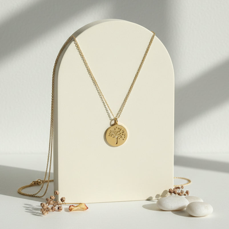 Gold tree of life medallion necklace hanging — spiritual symbol jewelry for new beginnings