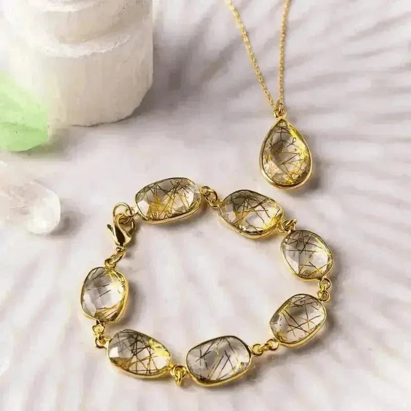 Gold rutilated quartz teardrop necklace with matching adjustable bracelet — crystal jewelry set