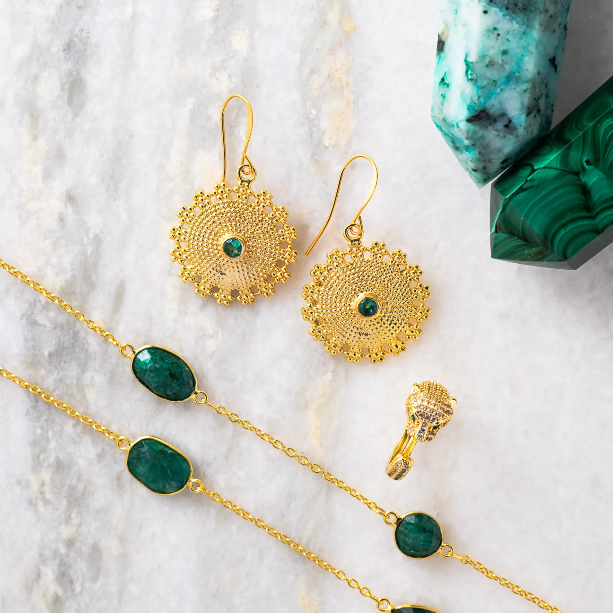 green medallion earrings in gold with emerald green chain necklace