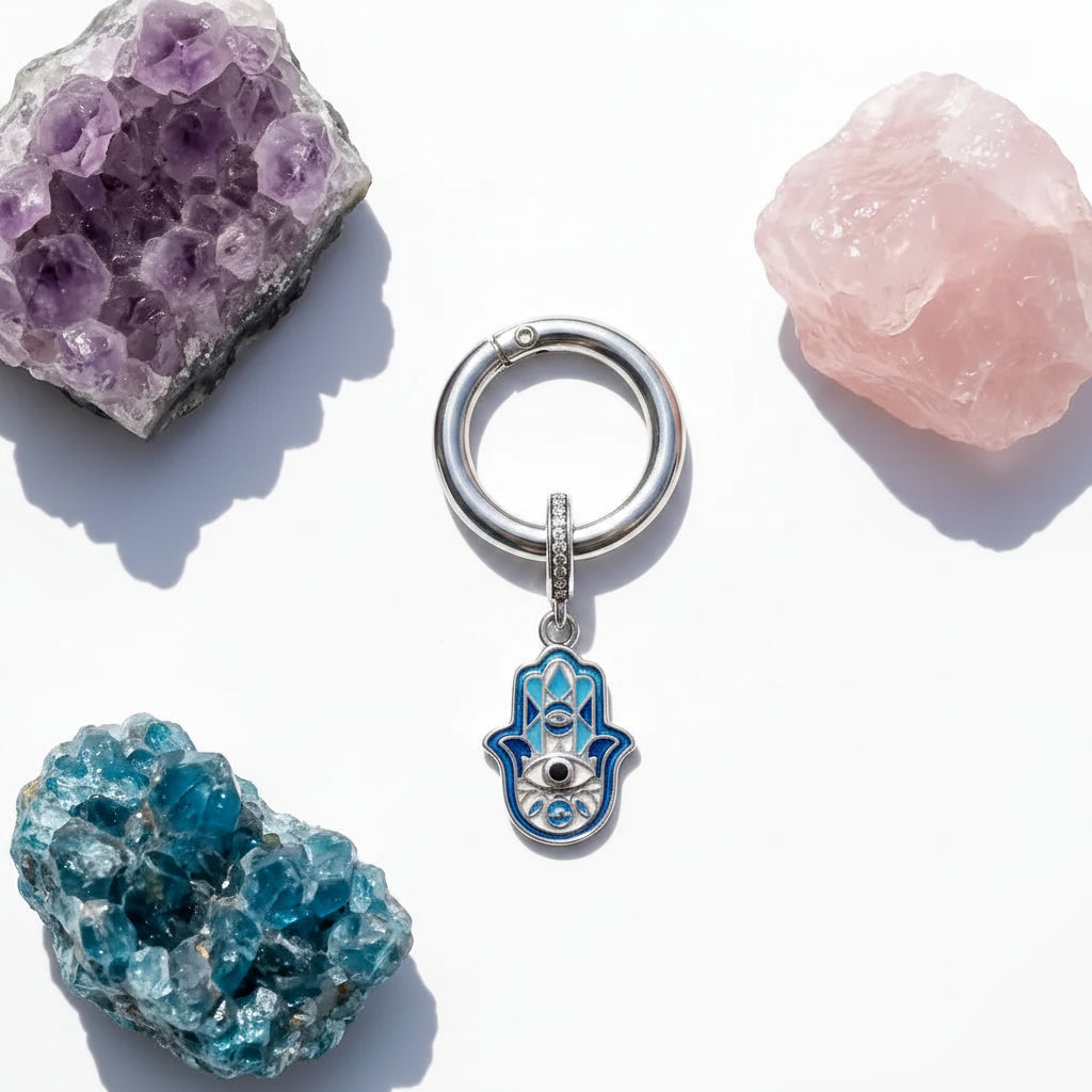 Matching hamsa set in sterling silver — owner pendant and pet collar charm shown together