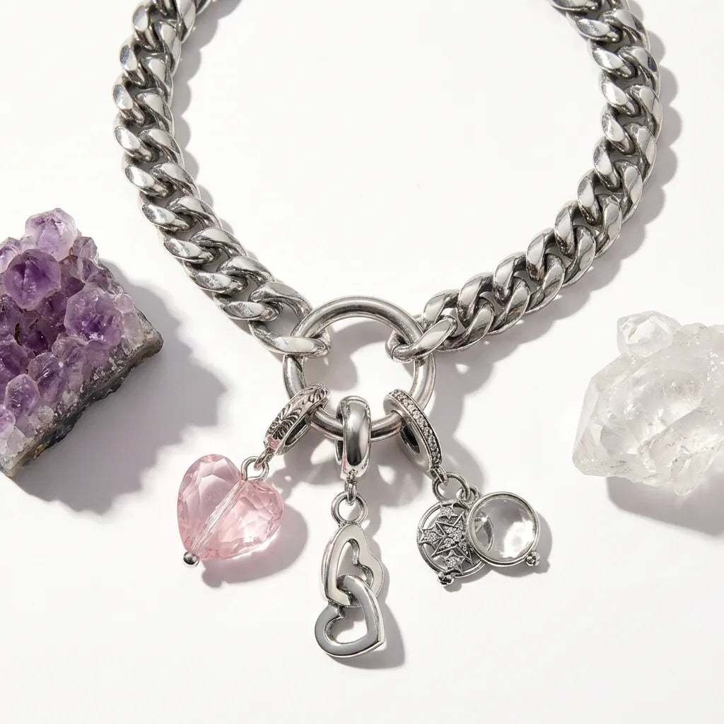 Silver chain bracelet with charms on a white background