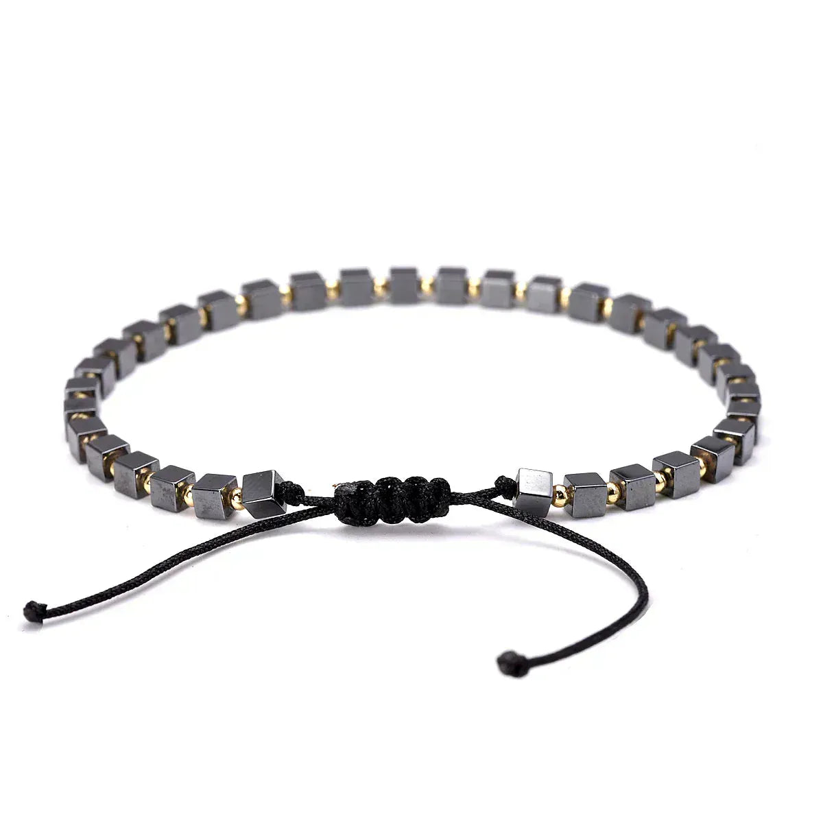 Bracelet with gray hexagonal beads and black cord on a white background