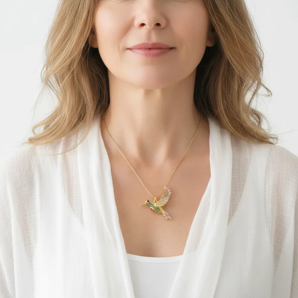 Woman wearing a hummingbird pendant necklace, spirit animal jewelry