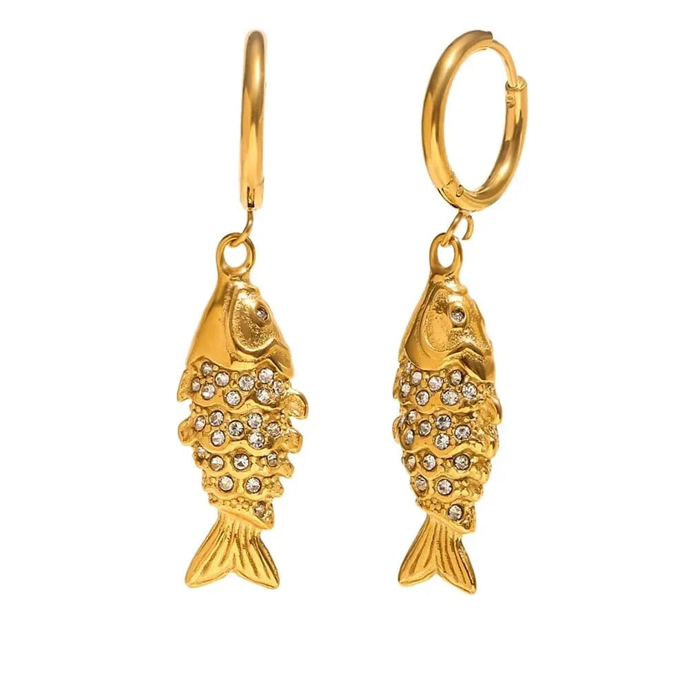 Gold fish-shaped earrings with rhinestones on a white background
