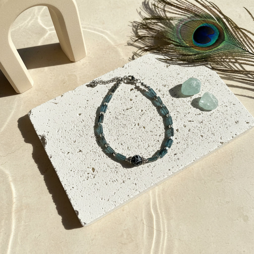 Kyanite brick-bead bracelet with a carved agate dzi focal bead and silver-plated spacers