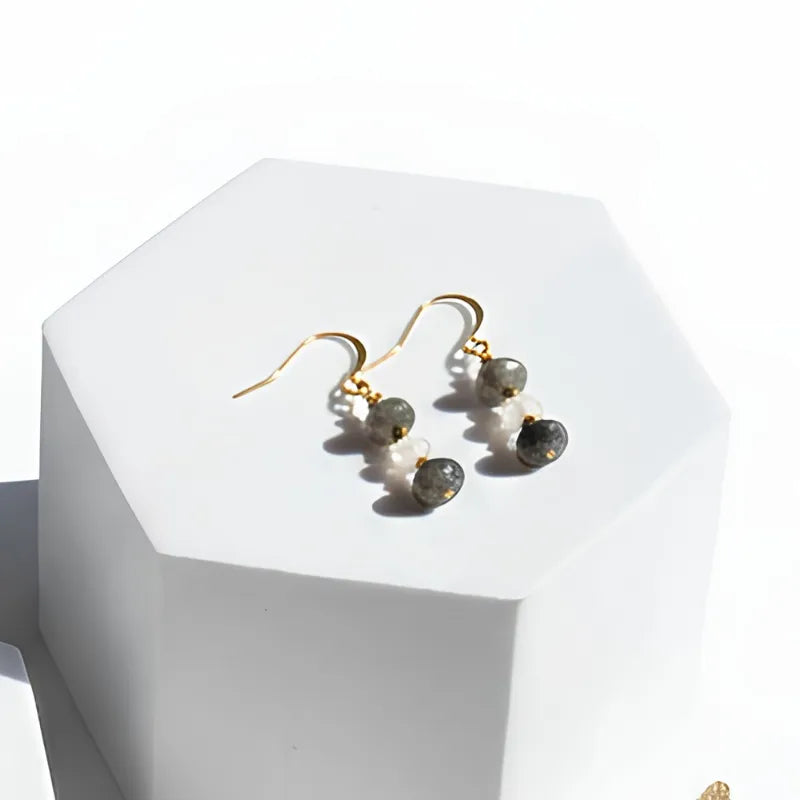 gold labradorite, moonstone and pyrite drop earrings on a stand — one-of-a-kind crystal jewelry for grounding