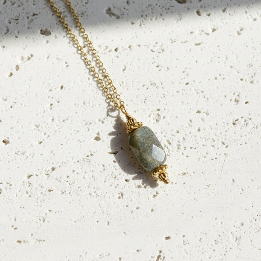 Necklace with a Labradorite pendant on a white background