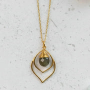 Silver necklace with a pendant on a white background