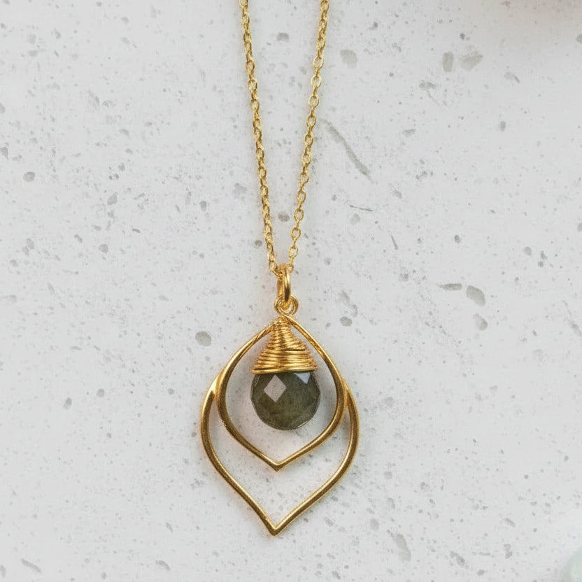 Silver necklace with a pendant on a white background