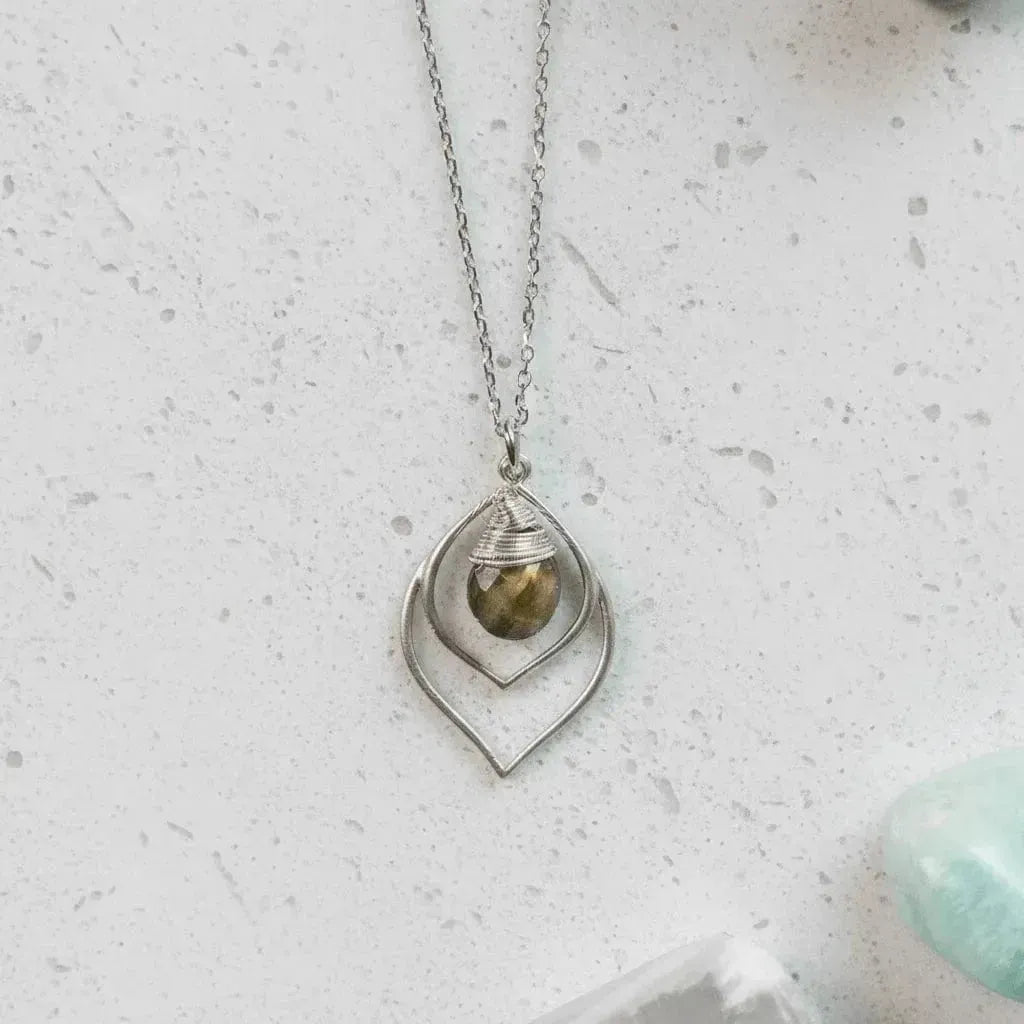 Silver necklace with a pendant on a white background