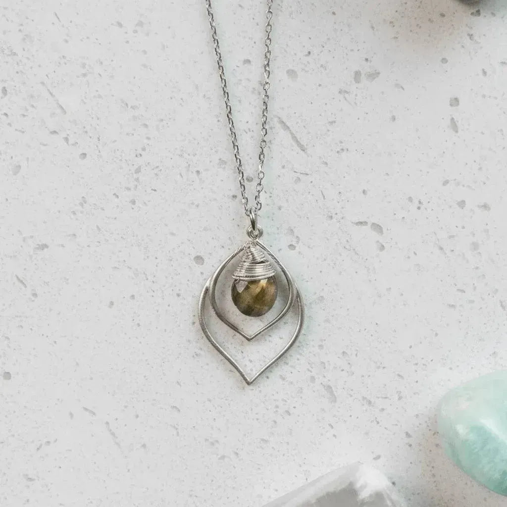 Silver necklace with a pendant on a white background