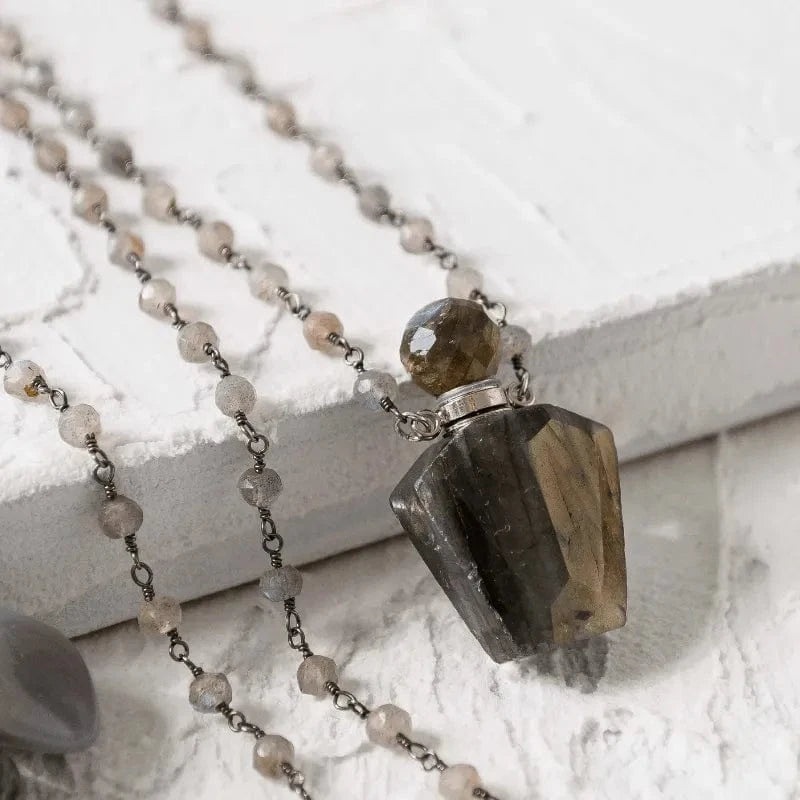 Necklace with a stone pendant on a white surface