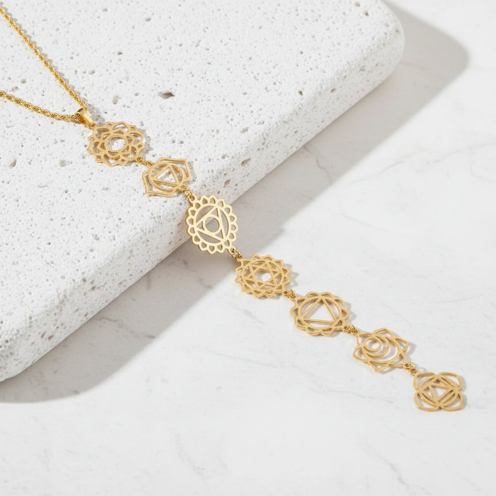 Chakra Gold necklace with intricate design on a white  background