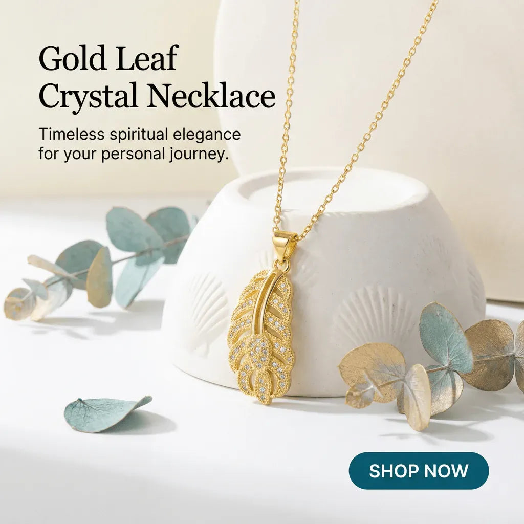 Gold leaf crystal necklace on a white dish with eucalyptus leaves, 'Shop Now' button visible.