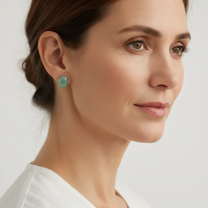 Gold amazonite water drop stud earrings held in hand — throat chakra jewelry for calm