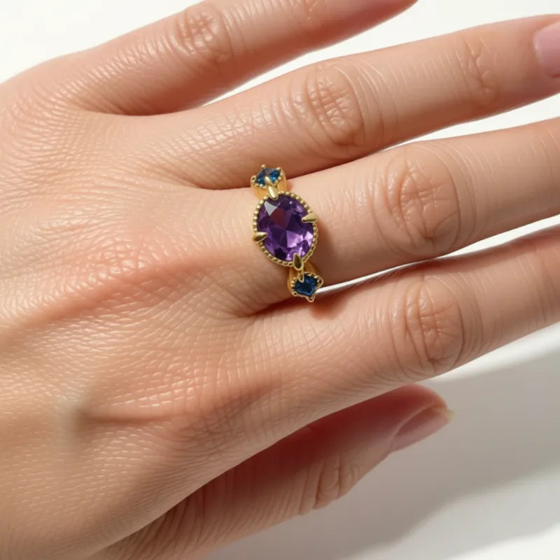 Woman wearing the amethyst and blue topaz gold plated sterling silver ring