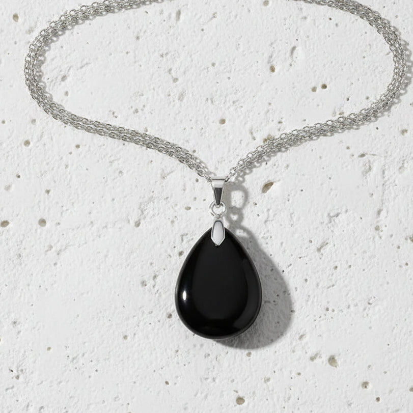 Silver black onyx teardrop necklace — root chakra jewelry for grounding and protection