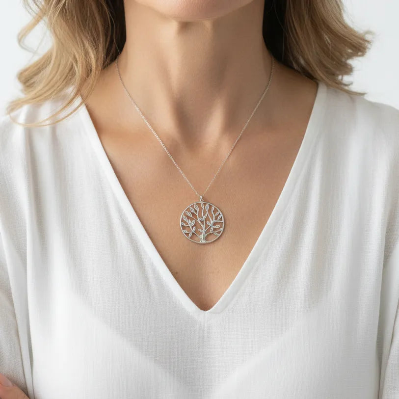 Woman wearing a silver plated crystal tree of life necklace, spiritual symbol jewelry