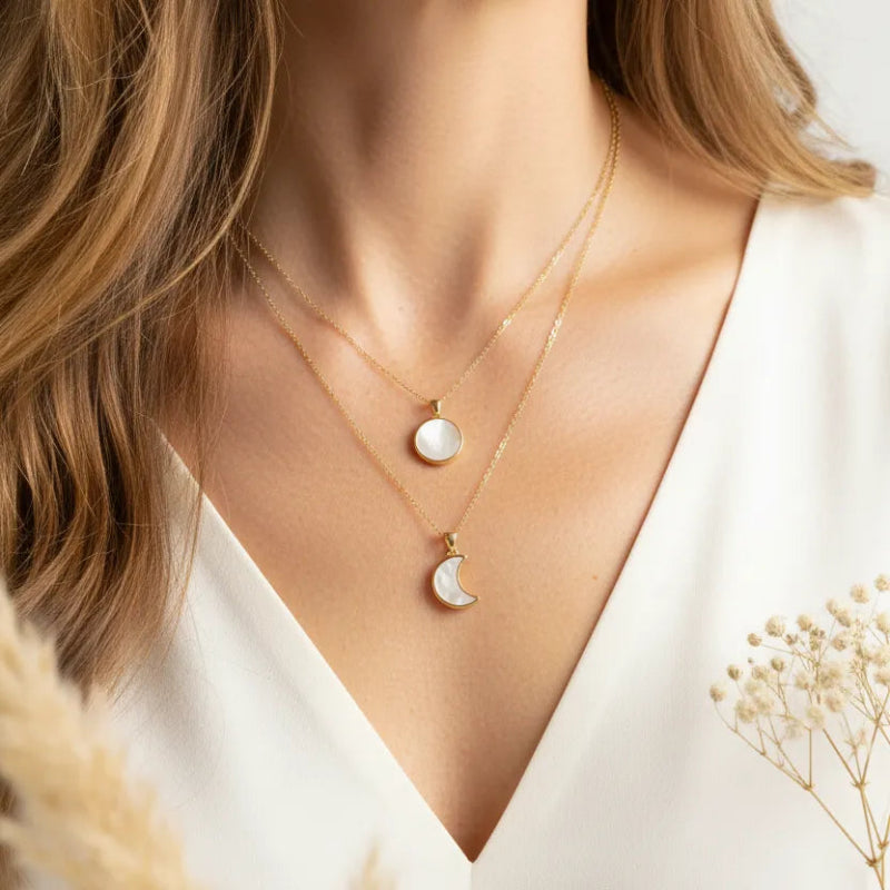 Woman wearing La Luna mother of pearl crescent moon necklaces, celestial jewelry