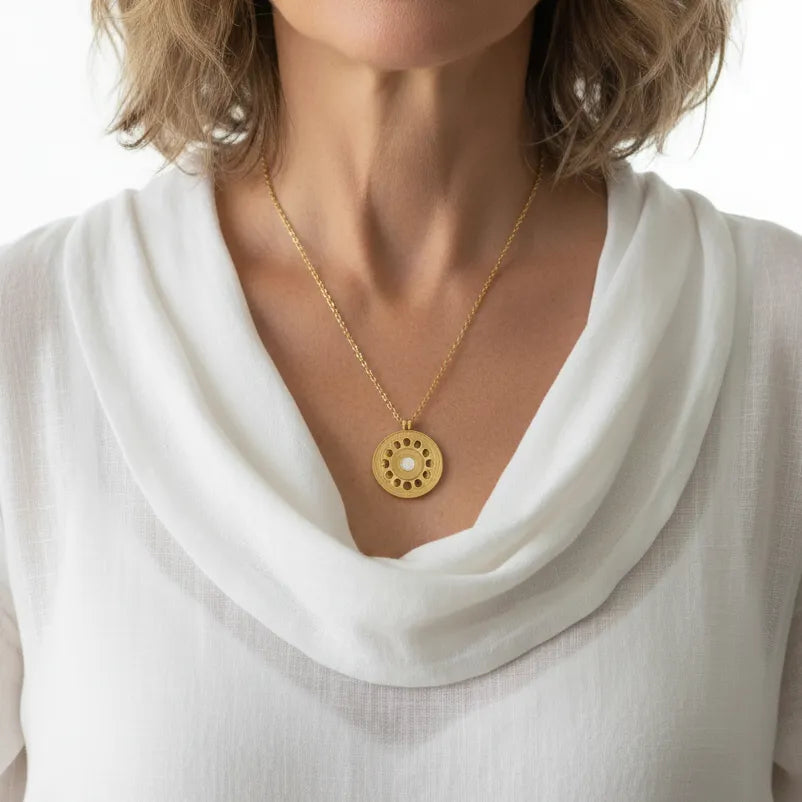 Woman wearing a moon phase necklace, celestial jewelry