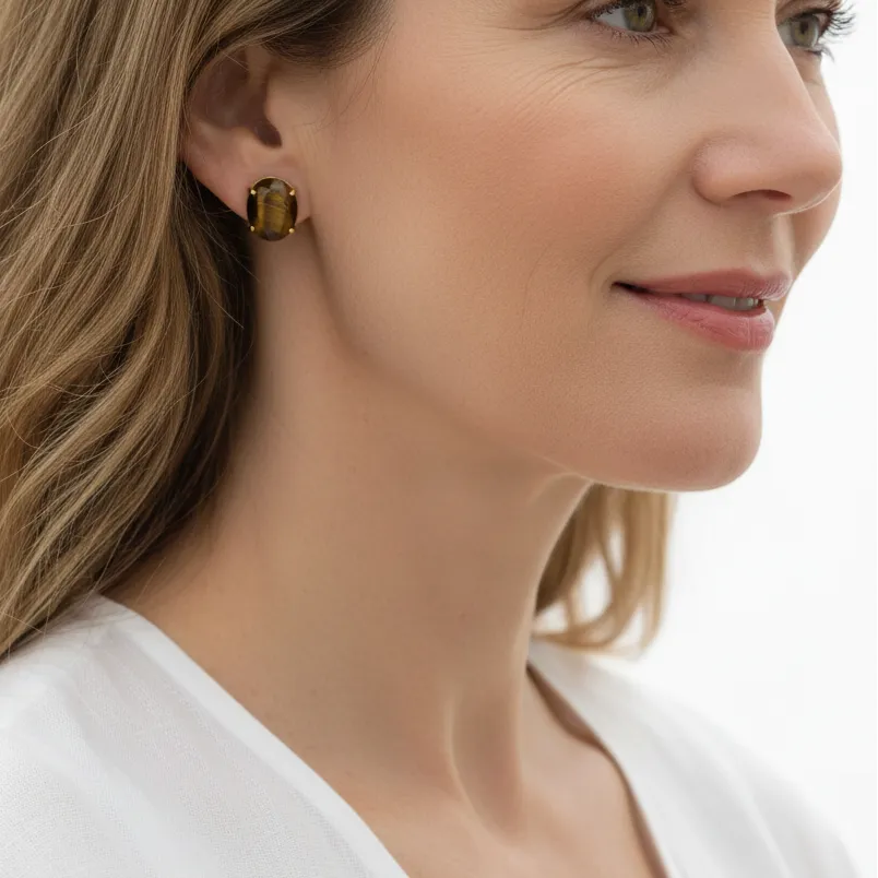 Woman wearing tiger eye stud earrings