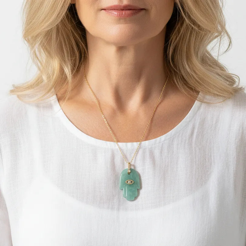 Woman wearing an amazonite hamsa hand pendant necklace, protection symbol jewelry