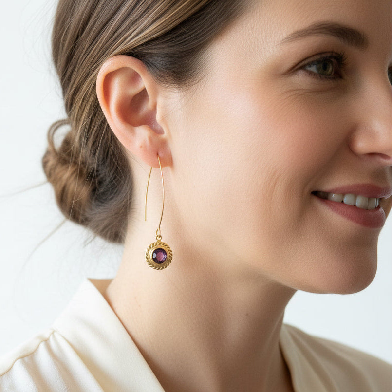 Woman wearing Amethyst Halo drop earrings on long ear wires