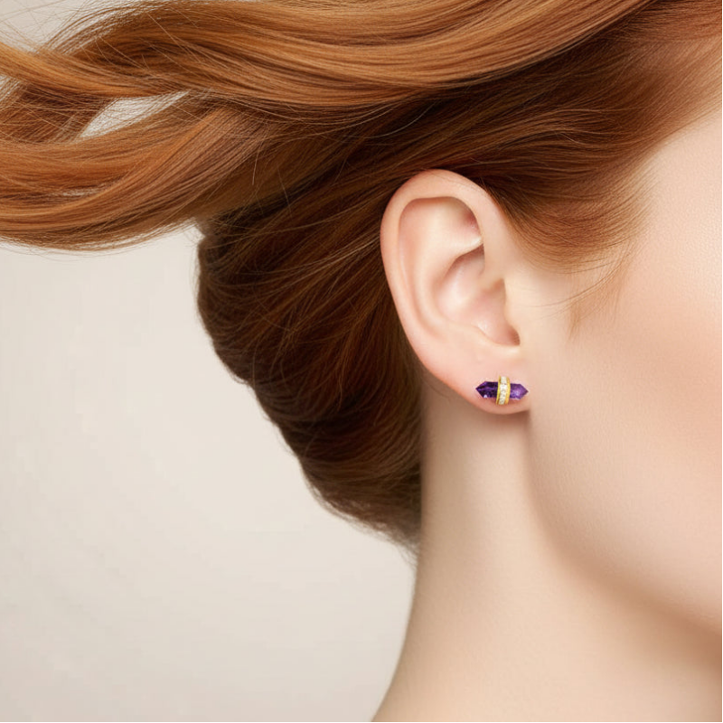 Woman wearing gold amethyst hexagon stud earrings, February birthstone jewelry