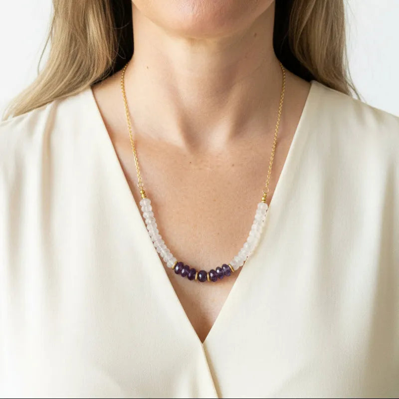 Woman wearing an amethyst and moonstone graduated necklace