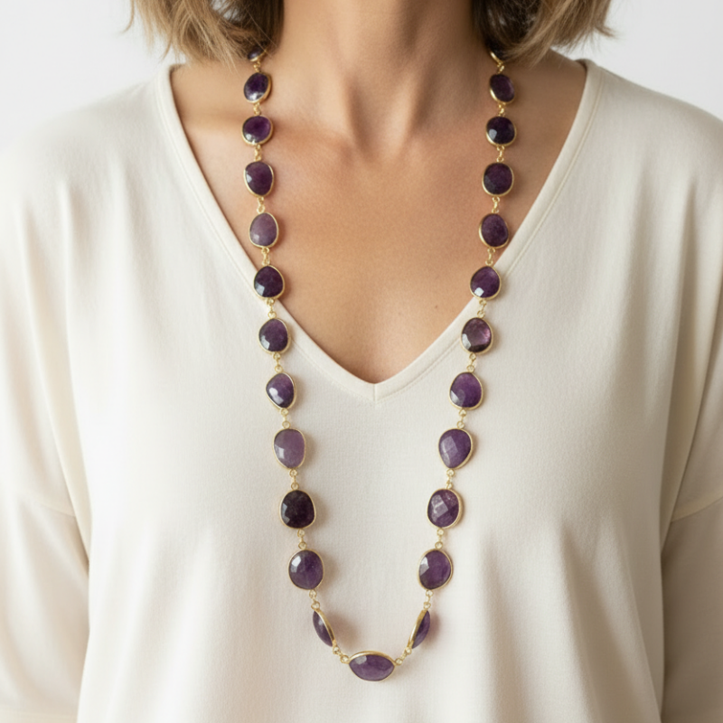 Woman wearing 32 inch natural amethyst oval necklace on gold plated links, February birthstone
