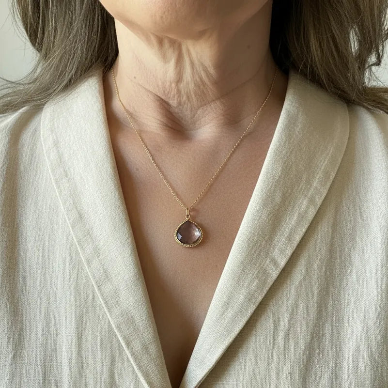 Woman wearing the ametrine pendant necklace in the detailed edge design