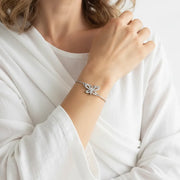 Woman wearing a sterling silver butterfly bracelet, spirit animal jewelry for transformation